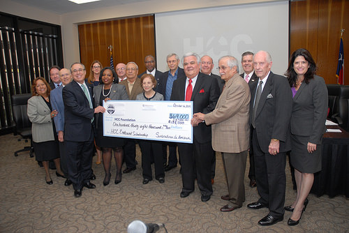 Check presentation for scholarships during October Board of Trustees meeting